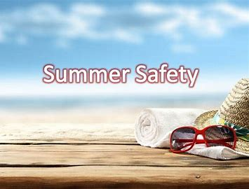 Summer Safety - beach towel, sun glasses and hat on board at ocean