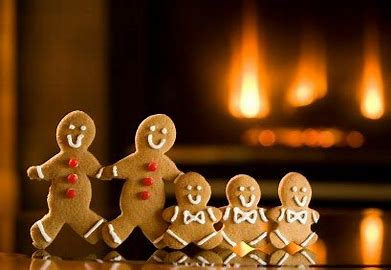 Gingerbread family in front of fire in chimney